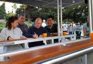 Gov. Jerry Brown signs SB 350 at an informal "brew bike" in Sacramento. Photo courtesy of fox40.com