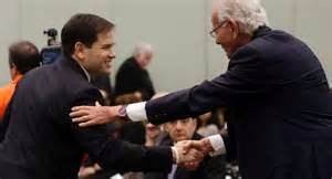 Prez candidate Marco Rubio (R-FL) bows to rich car dealer Norman Braman, "the man in France."