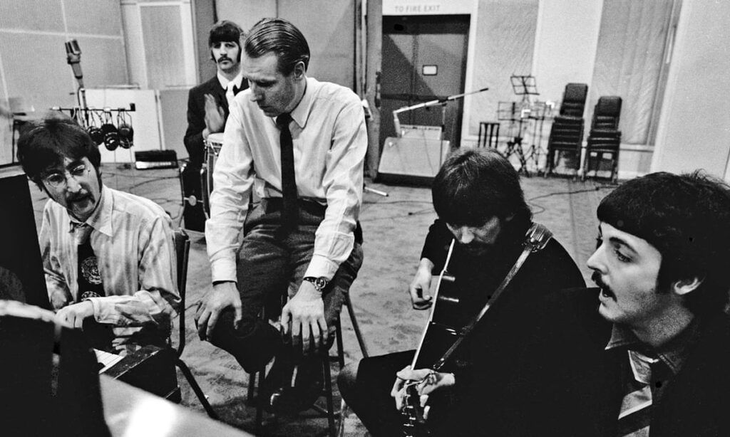 The Beatles and producer George Martin.