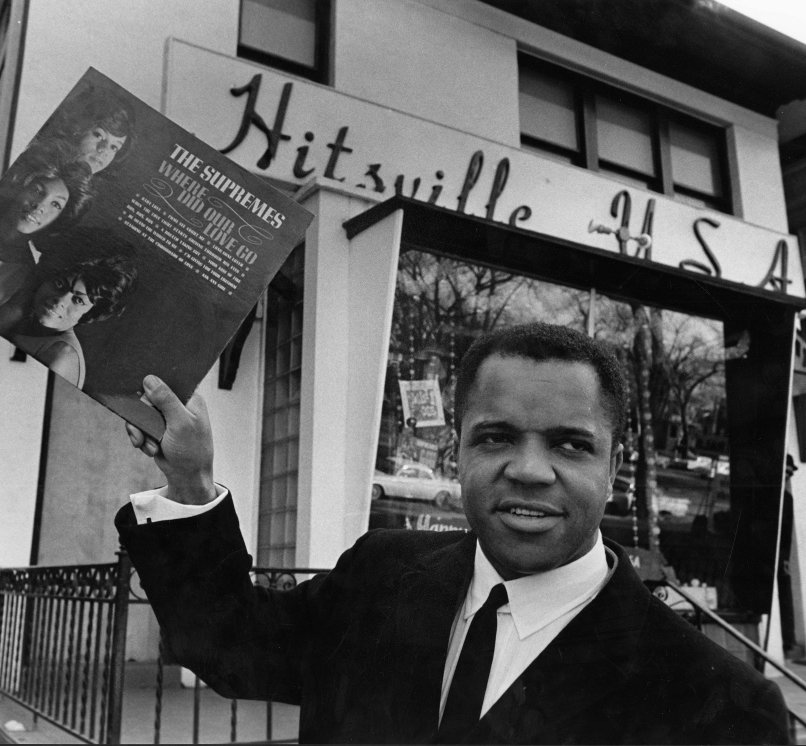 Berry Gordy with Motown Records in the background.